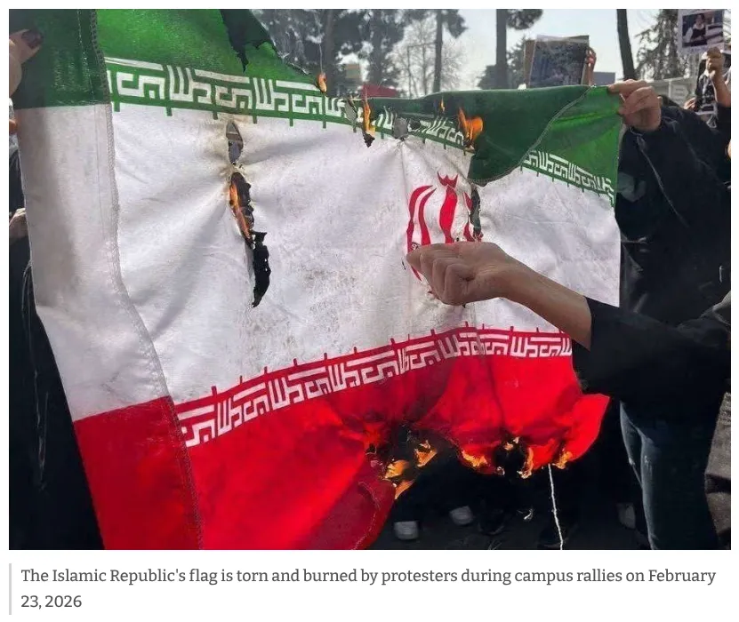 Image showing the Islamic Republic's flag is torn and burned by protesters during campus rallies on February 23, 2026.